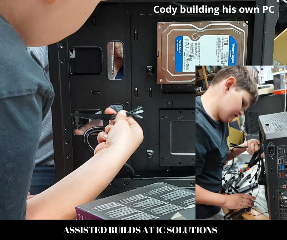 Cody cabling up his own PC build at the IC-Solutions workbench